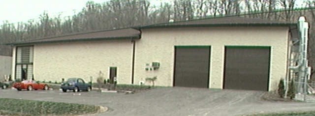 The rebuilt shop, raised out of the floodplain and back at work.